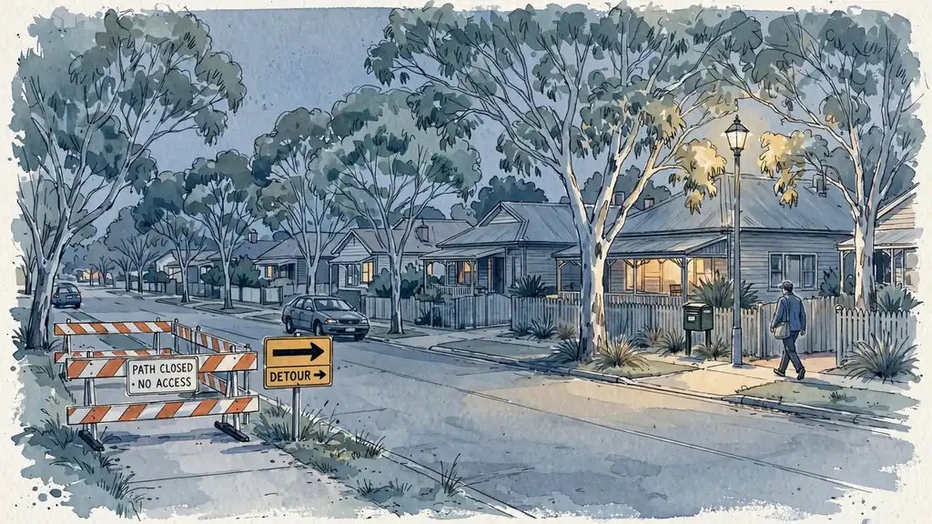 Barrier blocking a suburban street path at dusk